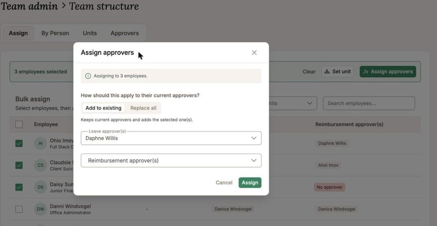 Three employees ticked and the assign dialog open, offering to add the approver or replace the existing ones